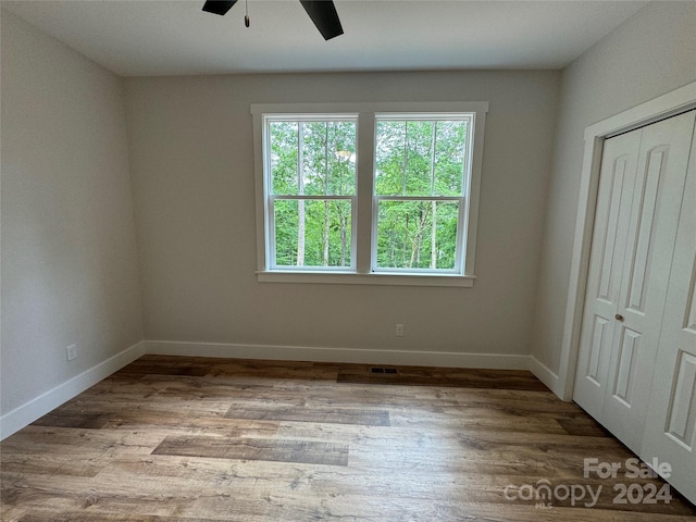 empty room with light hardwood / wood-style flooring