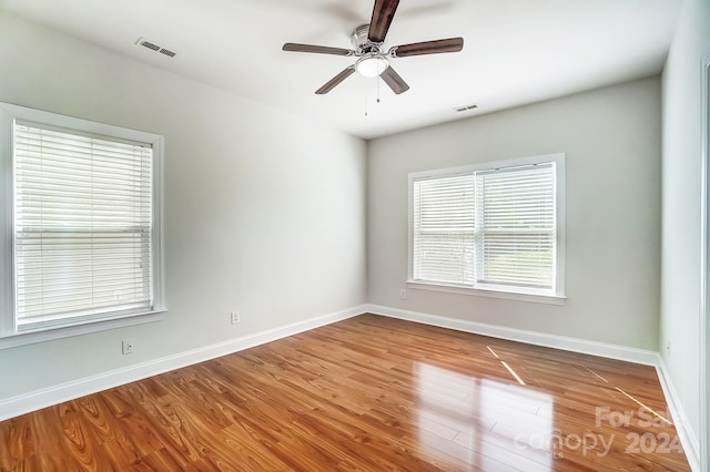 unfurnished room featuring ceiling fan and wood-type flooring