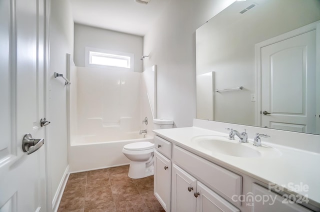 full bathroom featuring vanity, tile patterned floors, bathtub / shower combination, and toilet