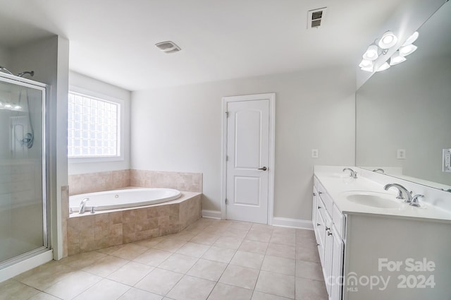 bathroom featuring vanity, independent shower and bath, and tile patterned flooring