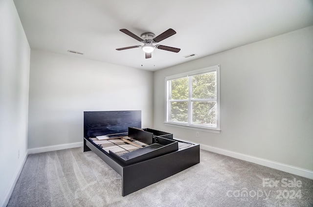 office with carpet floors and ceiling fan