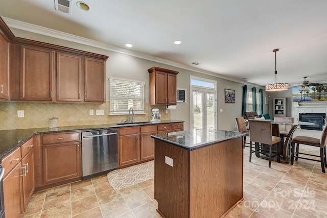 kitchen featuring ceiling fan, dishwasher, sink, hanging light fixtures, and tasteful backsplash