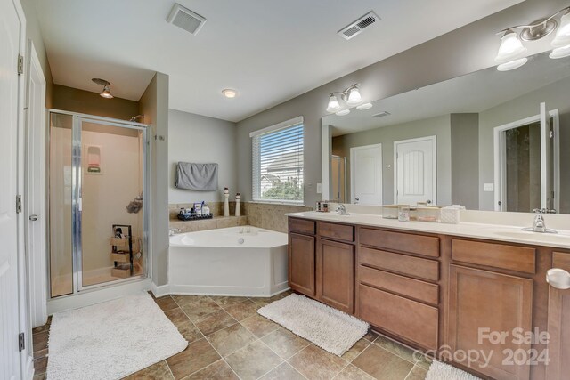 bathroom featuring plus walk in shower and vanity