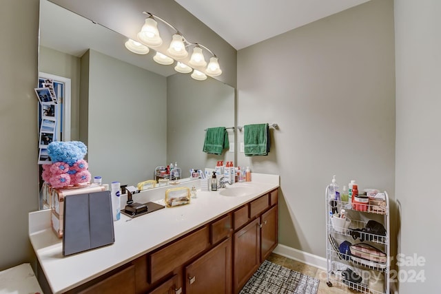 bathroom featuring tile patterned flooring and vanity