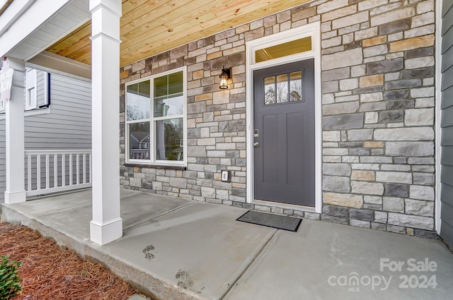 property entrance featuring covered porch