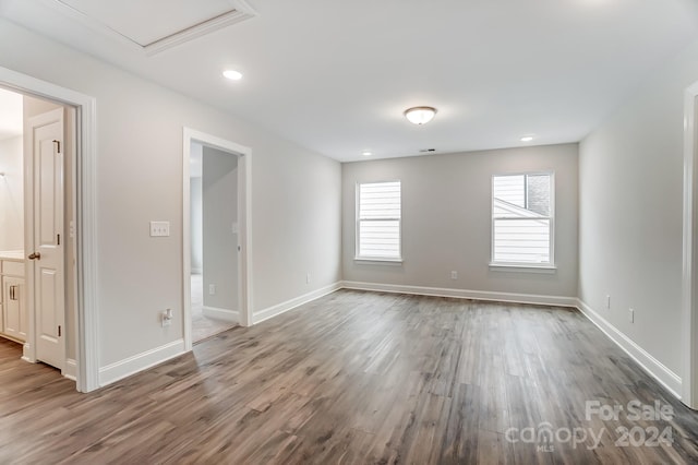 unfurnished room featuring hardwood / wood-style floors