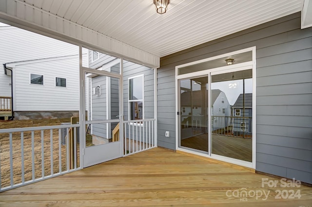 unfurnished sunroom with wooden ceiling