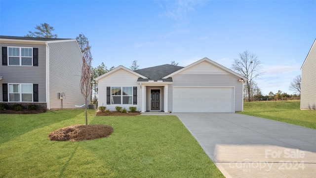 single story home featuring a garage and a front lawn