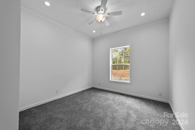 carpeted empty room with ceiling fan, crown molding, and a textured ceiling