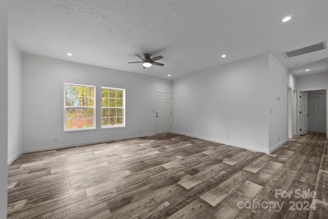 unfurnished room featuring ceiling fan, a textured ceiling, and hardwood / wood-style floors