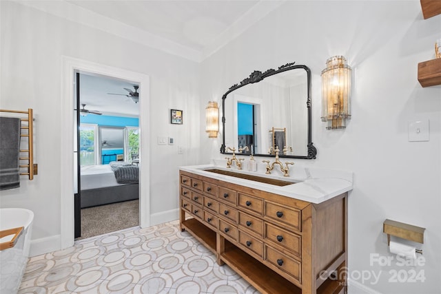 bathroom featuring ceiling fan, vanity, and tile patterned flooring