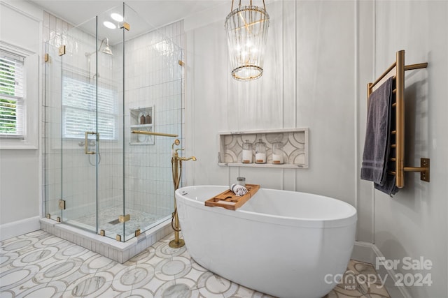 bathroom featuring independent shower and bath and tile patterned flooring