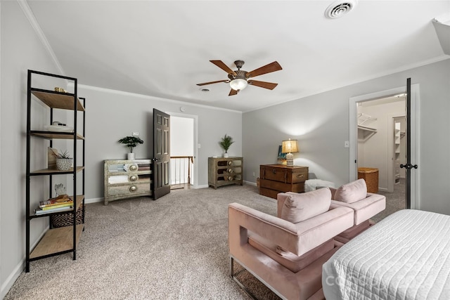 bedroom with crown molding, ceiling fan, and carpet