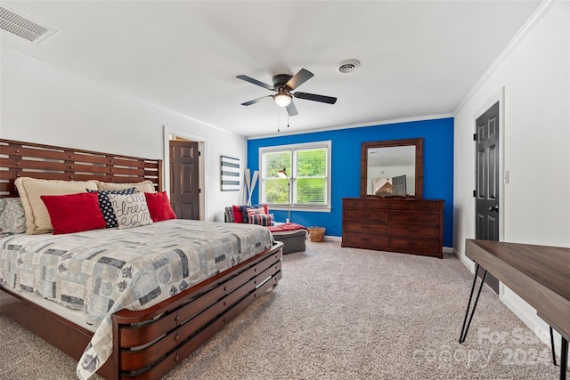 bedroom featuring ornamental molding, carpet flooring, and ceiling fan