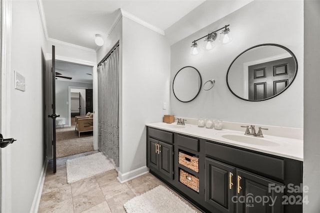 bathroom featuring double vanity, tile patterned floors, crown molding, and ceiling fan