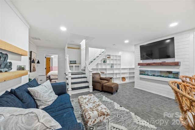 living room with tile patterned floors