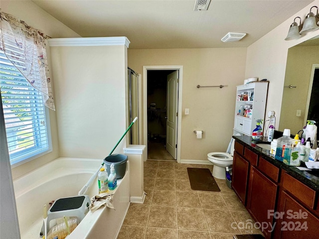 bathroom with tile patterned floors, plus walk in shower, and vanity