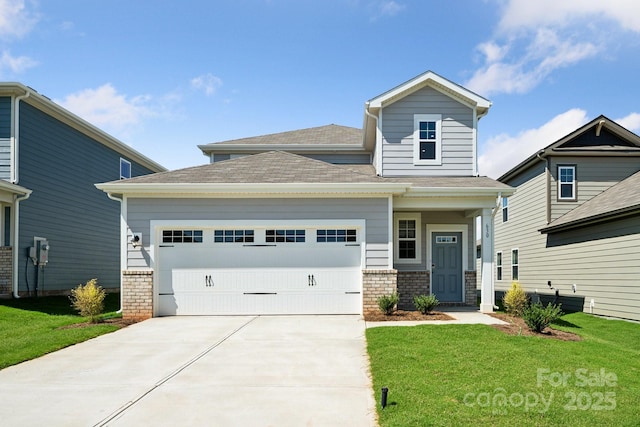 view of front of home with a garage and a front lawn