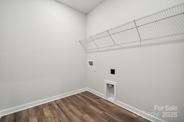 laundry area featuring electric dryer hookup, dark wood-type flooring, and washer hookup