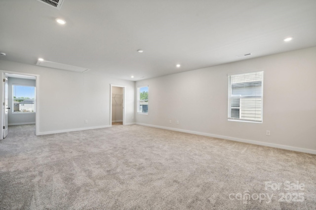 carpeted empty room featuring a healthy amount of sunlight