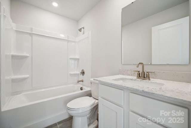 full bathroom featuring tile patterned floors, vanity,  shower combination, and toilet