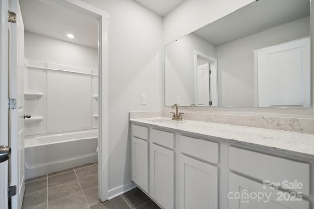 full bathroom featuring tile patterned flooring, vanity, toilet, and washtub / shower combination