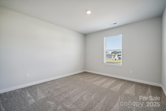 unfurnished room with carpet floors