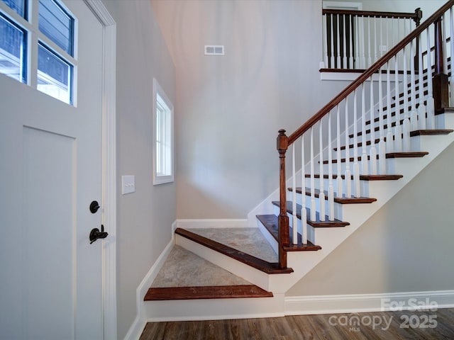 entryway with hardwood / wood-style floors and a wealth of natural light