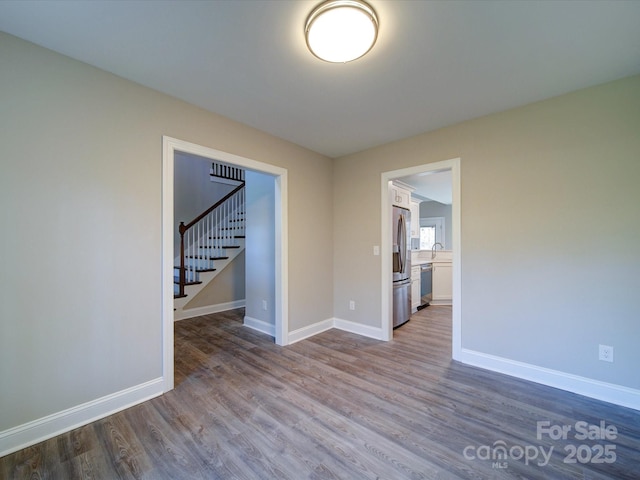 unfurnished room featuring hardwood / wood-style floors