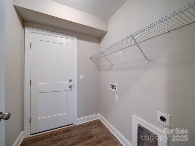 clothes washing area featuring dark hardwood / wood-style flooring, hookup for a washing machine, and electric dryer hookup