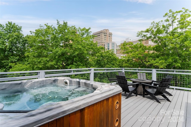 wooden terrace with a hot tub