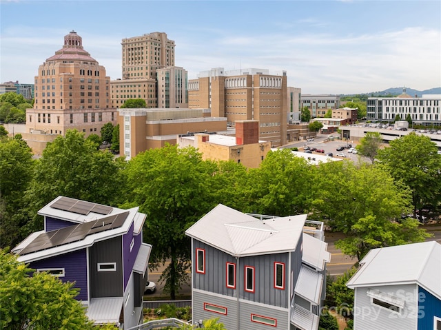 birds eye view of property featuring a city view
