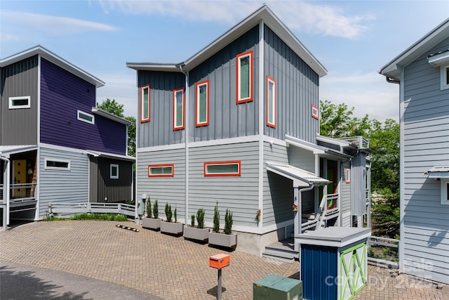 view of front of house with a patio and board and batten siding