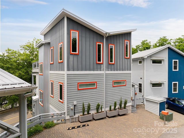 back of property with board and batten siding