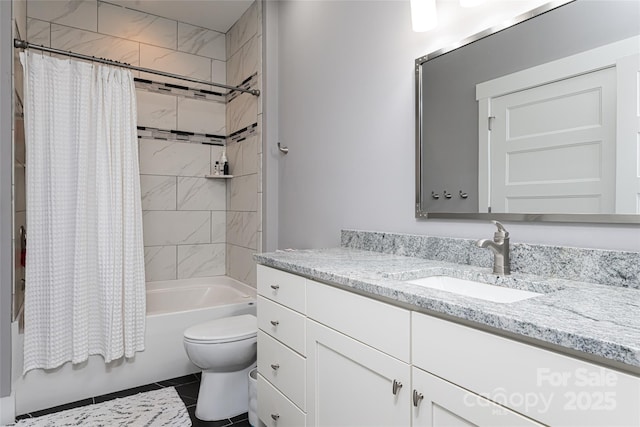 bathroom with toilet, shower / bath combo with shower curtain, tile patterned flooring, and vanity