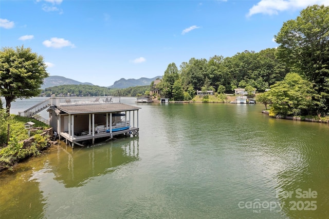 dock area with a water and mountain view