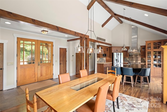 dining room with dark hardwood / wood-style flooring, high vaulted ceiling, french doors, and beamed ceiling