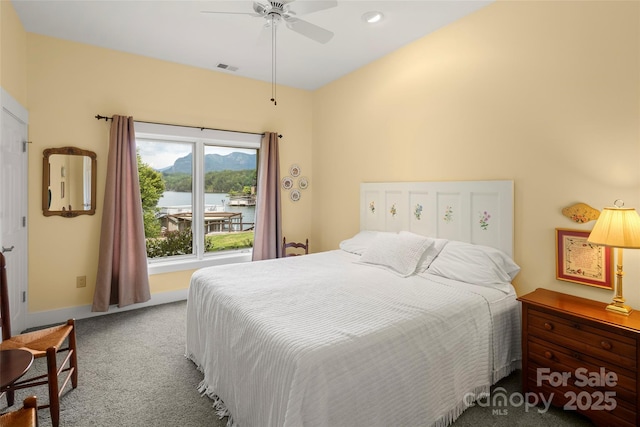 carpeted bedroom featuring ceiling fan