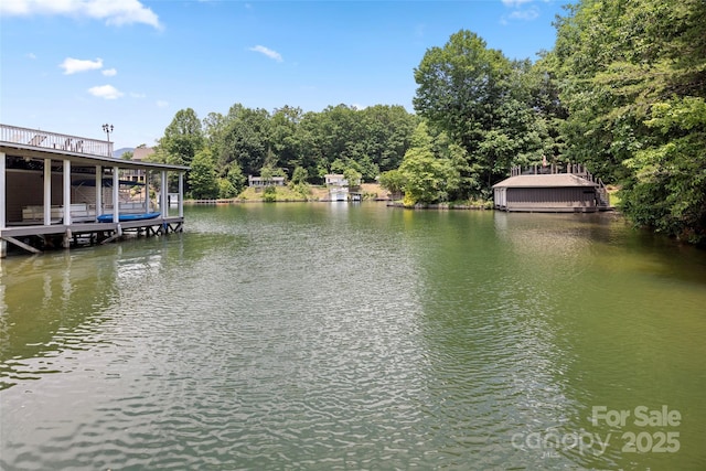 view of water feature with a dock