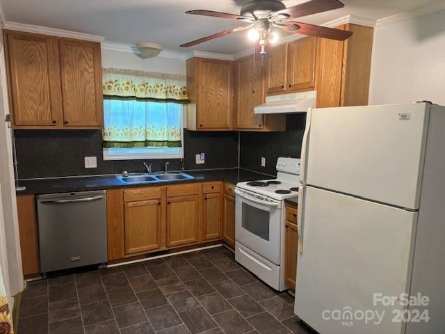 kitchen with dark tile floors, ceiling fan, tasteful backsplash, sink, and white appliances