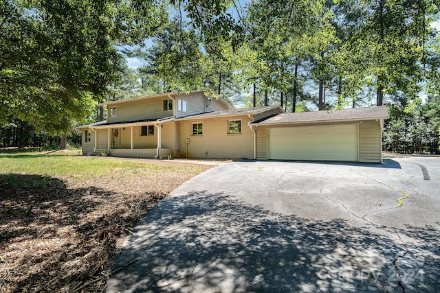 view of front facade with a porch and a garage