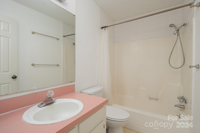 full bathroom featuring toilet, shower / bath combination with curtain, and vanity