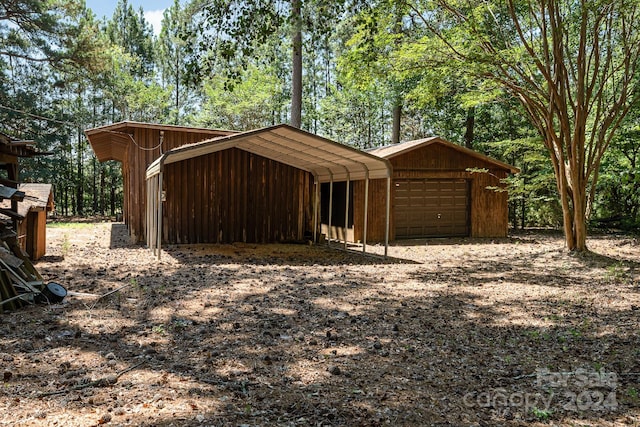 garage featuring a carport