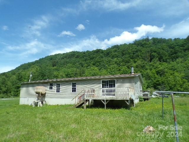 rear view of property with a deck