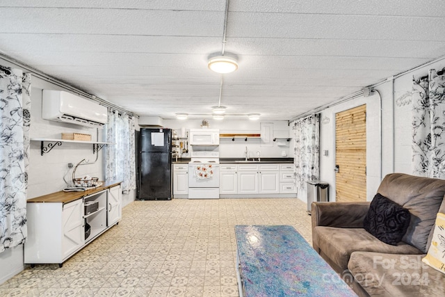 living room with light tile patterned floors, sink, and a wall unit AC