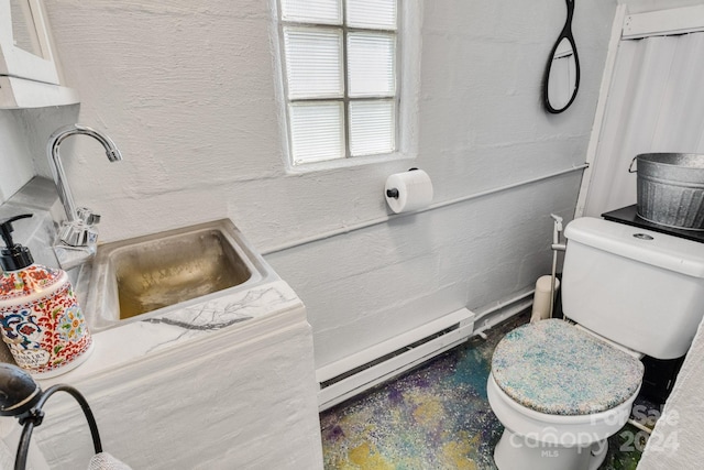 bathroom with sink, toilet, and a baseboard radiator