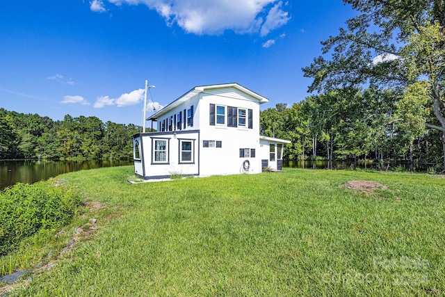 back of house featuring a lawn