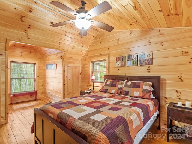 bedroom featuring light hardwood / wood-style flooring, lofted ceiling, and wooden ceiling