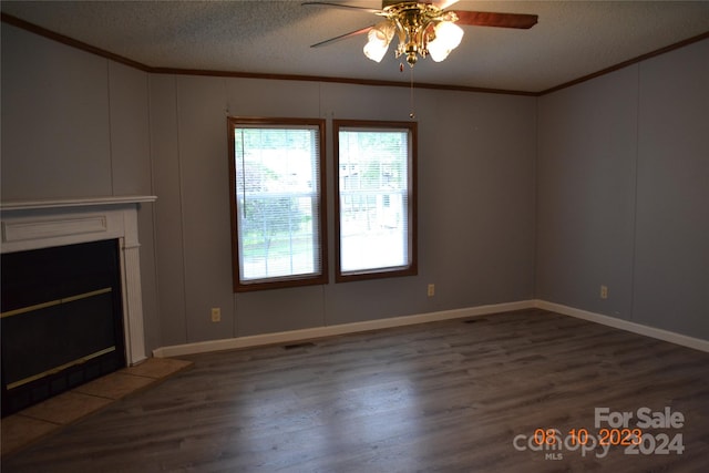 unfurnished living room with a textured ceiling, wood-type flooring, ceiling fan, and a tile fireplace