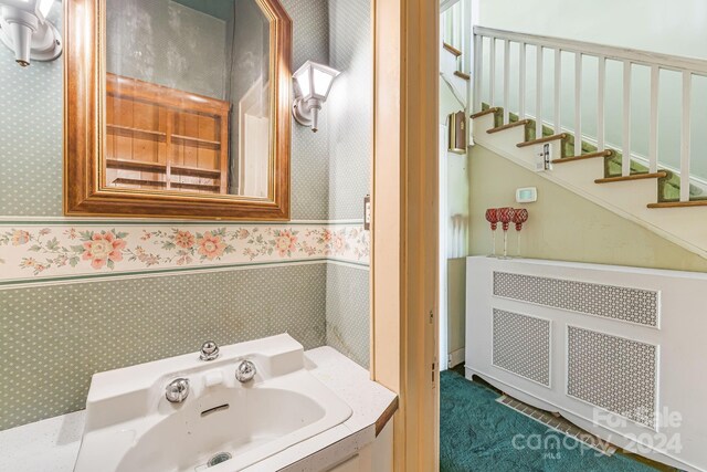 bathroom with radiator heating unit